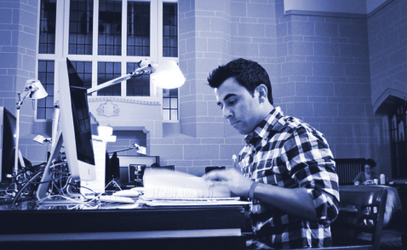 A guy studying in front of the computer